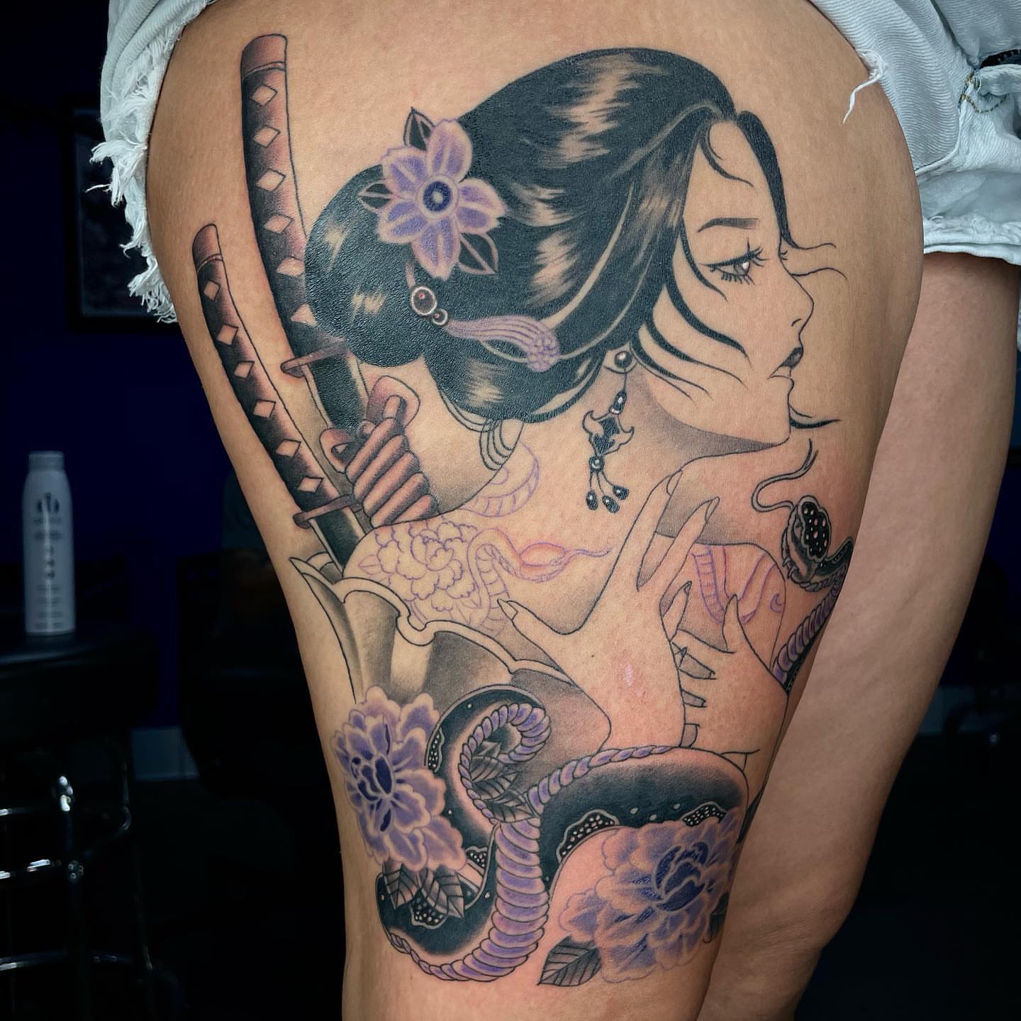 Geisha with sword American traditional tattoo on the thigh by Tam Nguyen