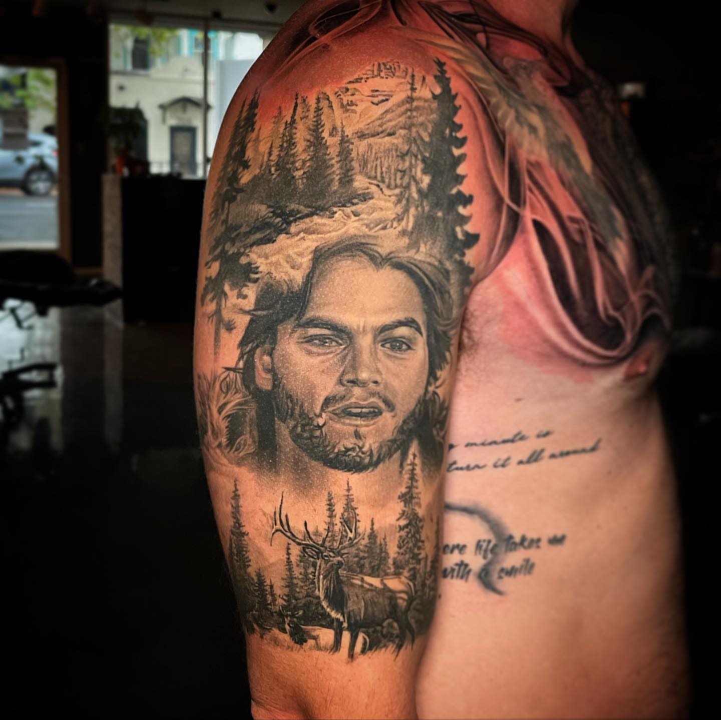 Portrait with forest and deer realism tattoo on the shoulder by Christian Medina, Sacramento, California