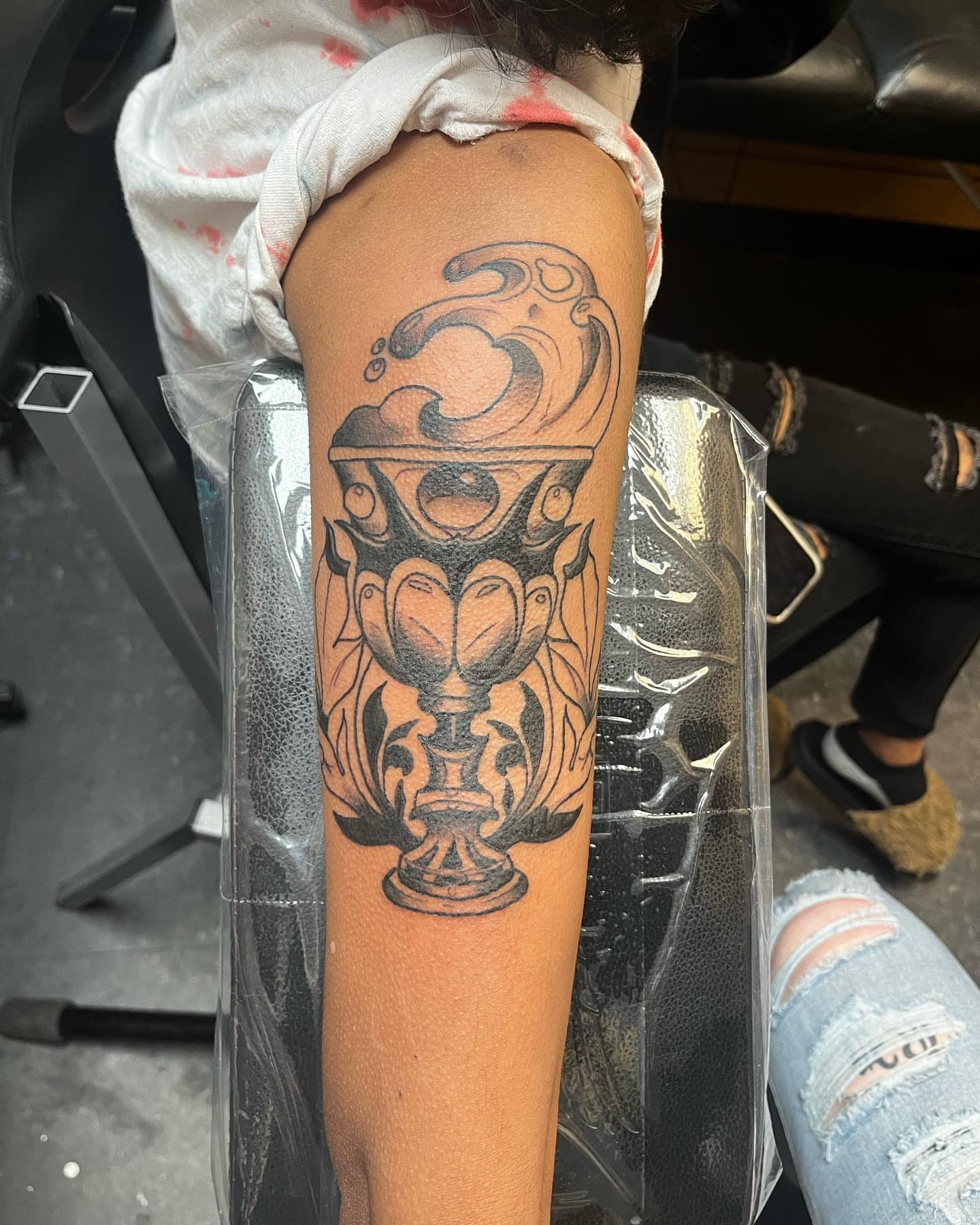 Trophy black and grey tattoo on the forearm by Alyssa Turner