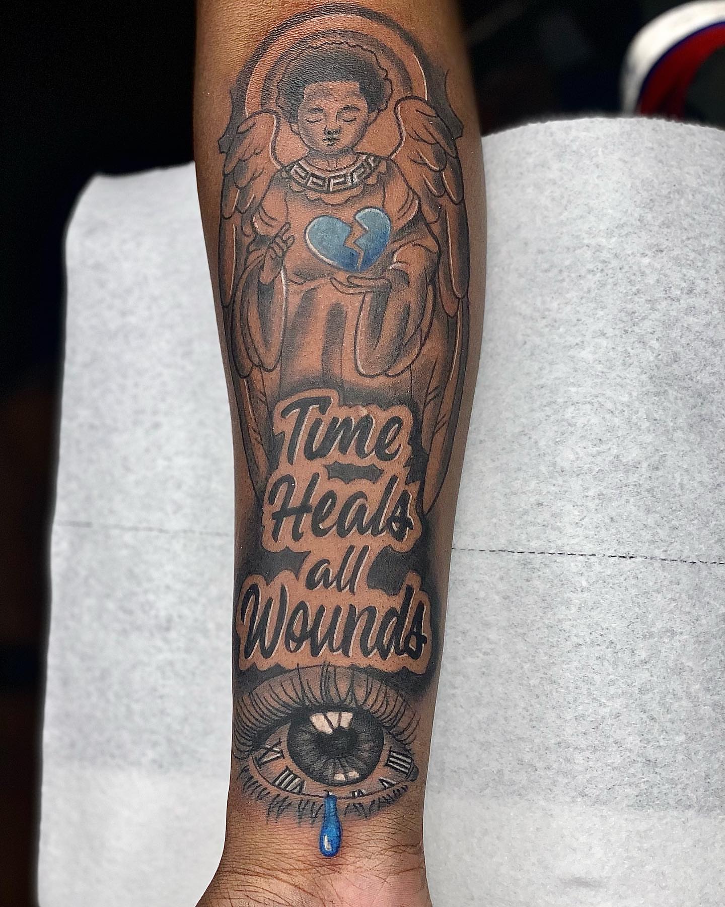 Time heals all wounds black and grey tattoo on the forearm by Prolific🏁so Gifted