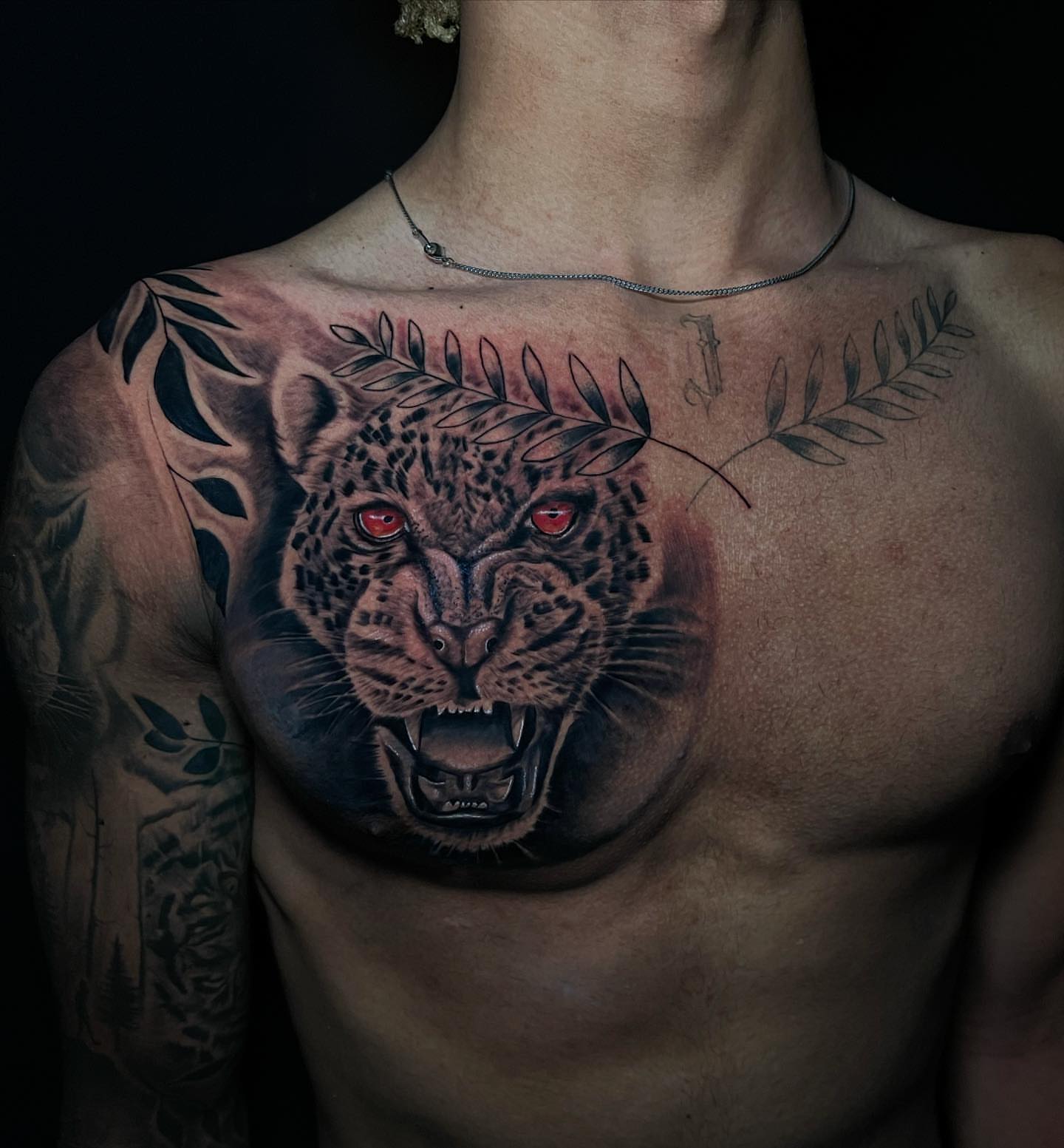 Jaguar realism tattoo on the chest by Dori