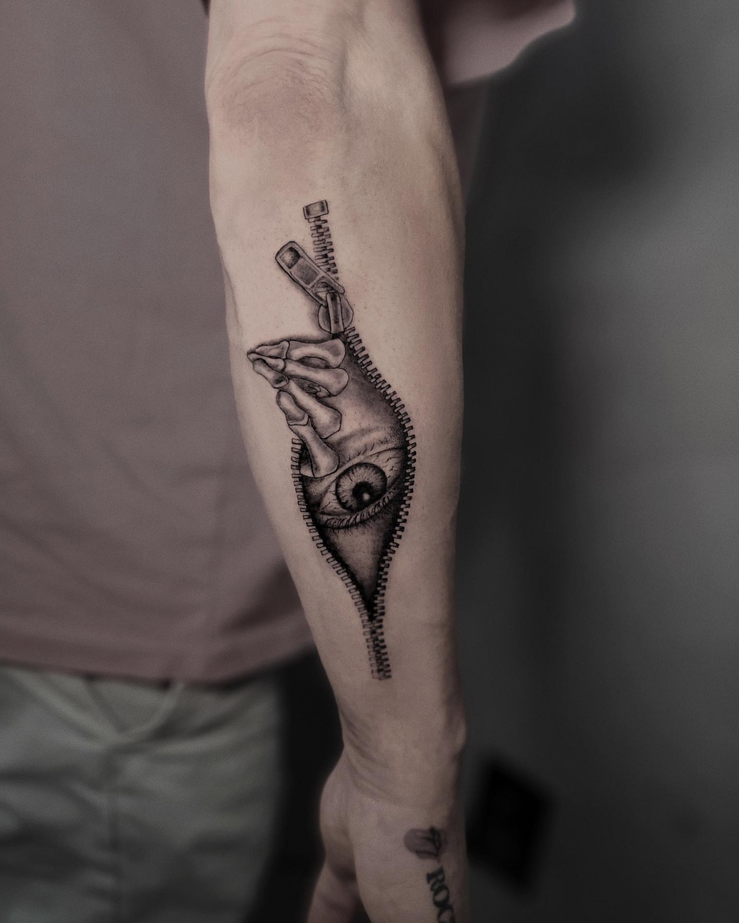 Eye and zipper realism tattoo on the forearm by Mateo