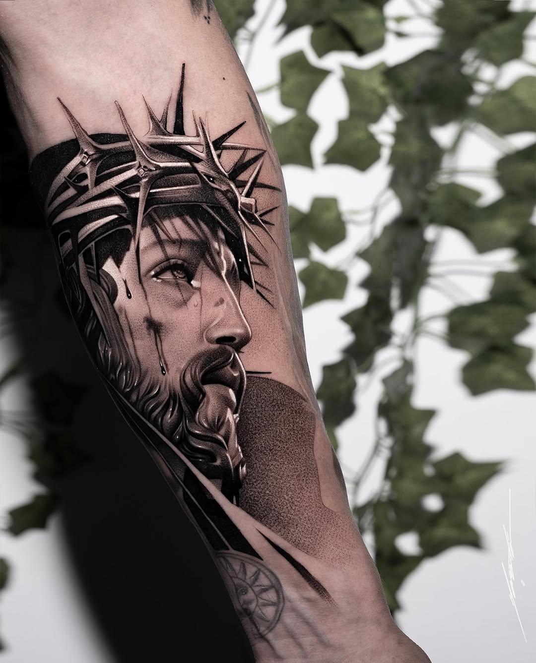 Jesus Christ with crown of thorns Chicano tattoo on the forearm by Ke$la