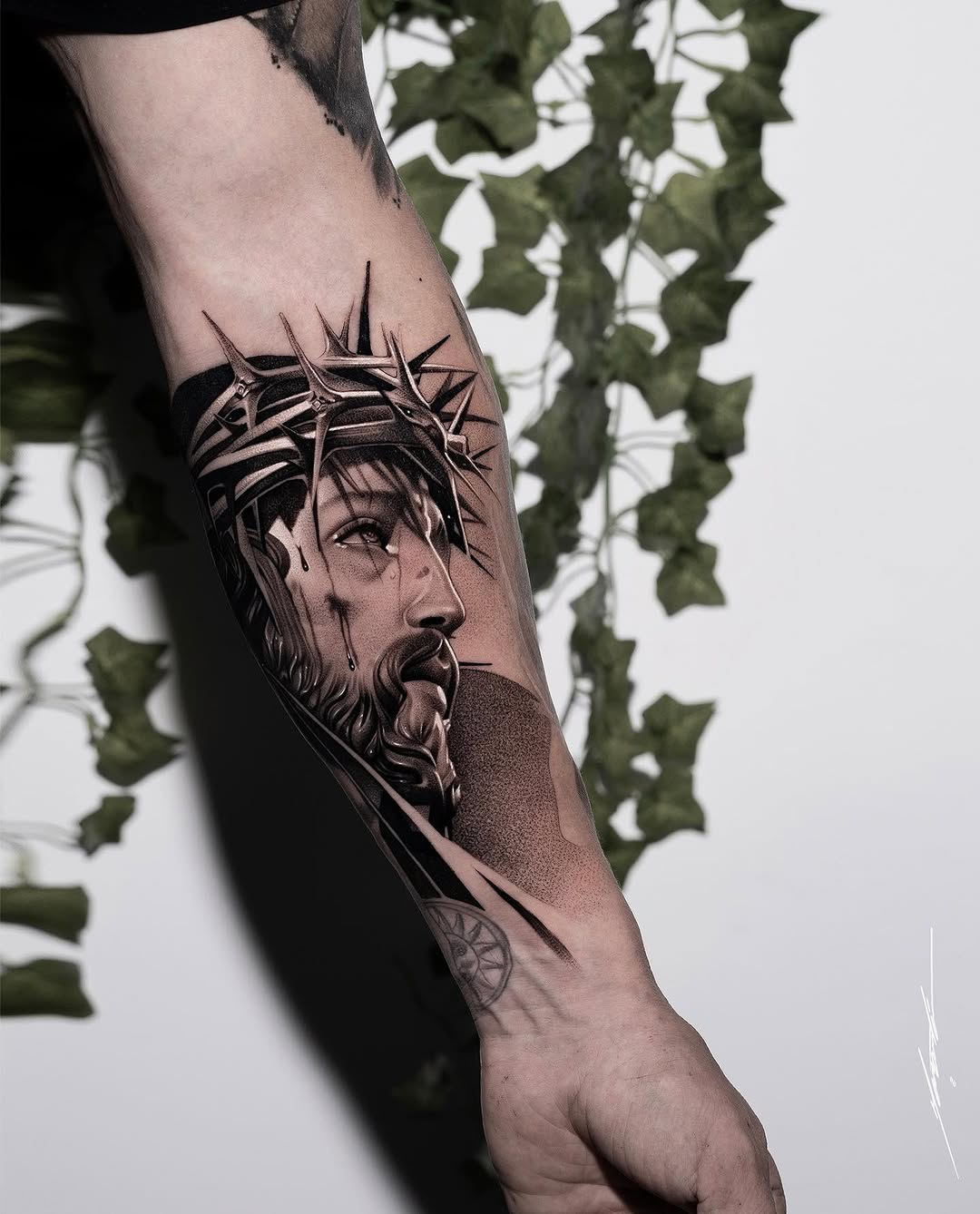 Jesus Christ with crown of thorns Chicano tattoo on the forearm by Ke$la