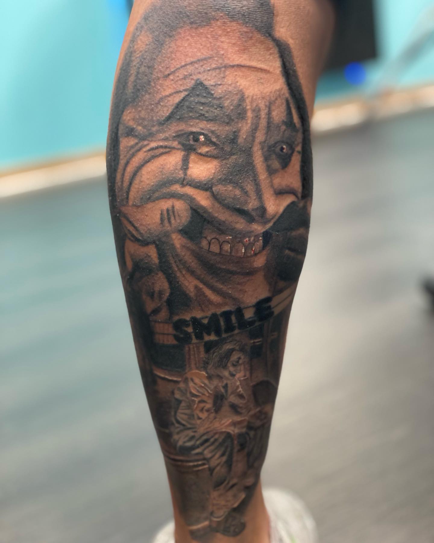 Clown face realism tattoo on the forearm by Alberto Ramirez