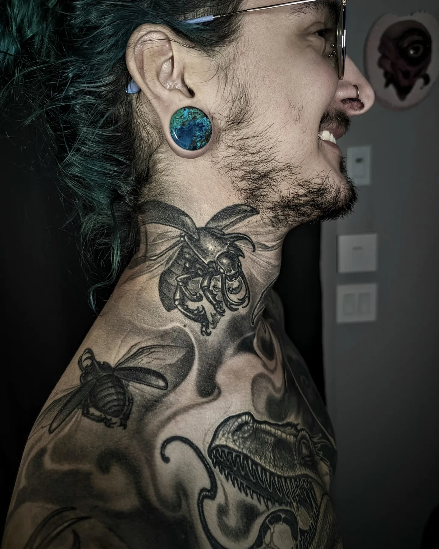 Bees and dinosaur black and grey tattoo on the shoulder by Matt Driscoll