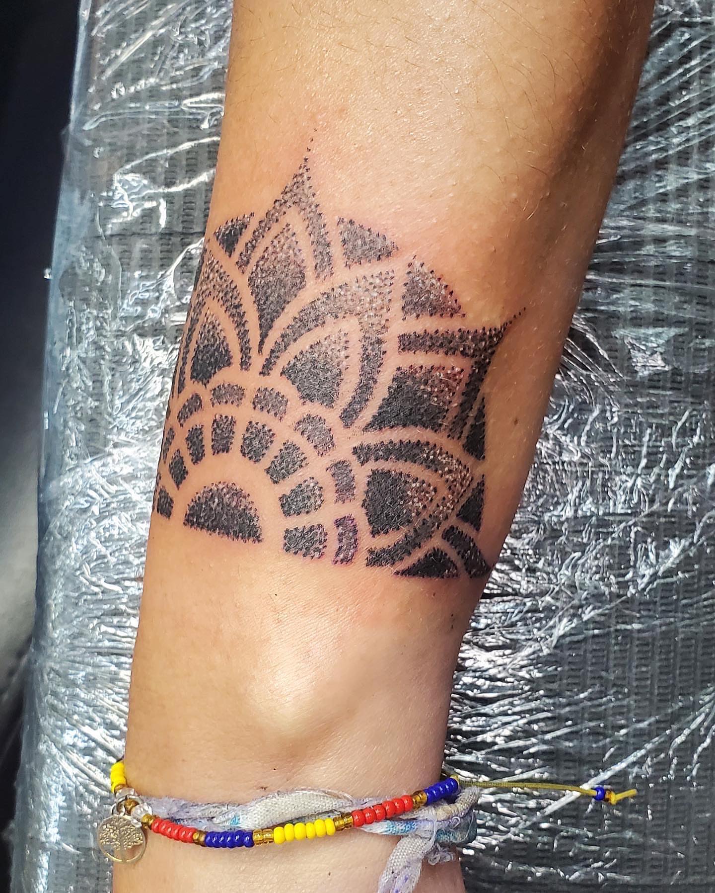 Geometric pattern dotwork tattoo on the forearm by William Gualteros
