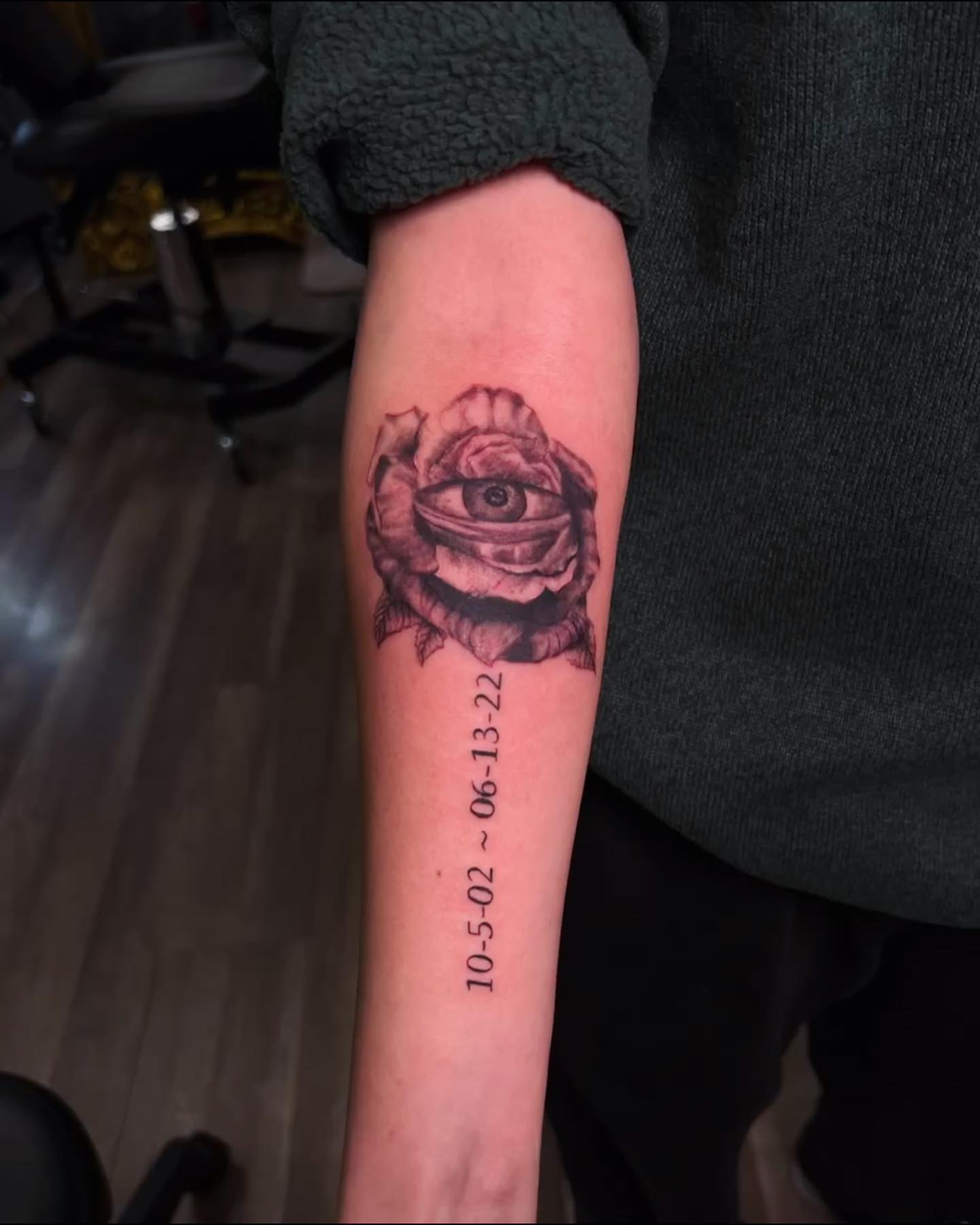 Eye within rose realism tattoo on the forearm by Tattoo Artist