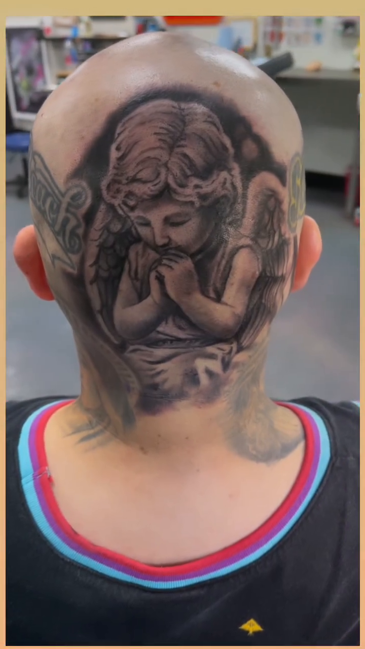 Cherub angel realism tattoo by Greg West Sac tattoo artist, West Sacramento, California