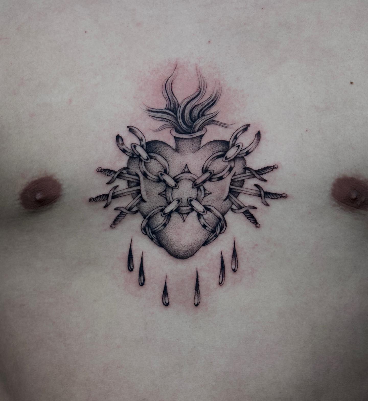 Heart with chains and swords neo-traditional tattoo on the chest by Chriscalibur