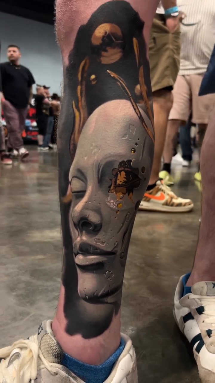 Surreal face with abstract elements surrealism tattoo on the forearm by Jacob Sheffield, Grand Junction, Colorado