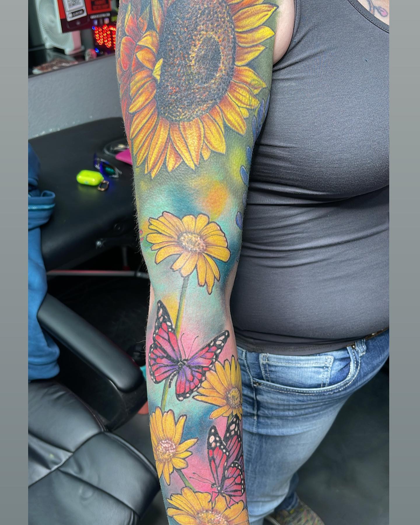 Sunflowers and butterflies realism tattoo on the forearm by Pablo Venegas