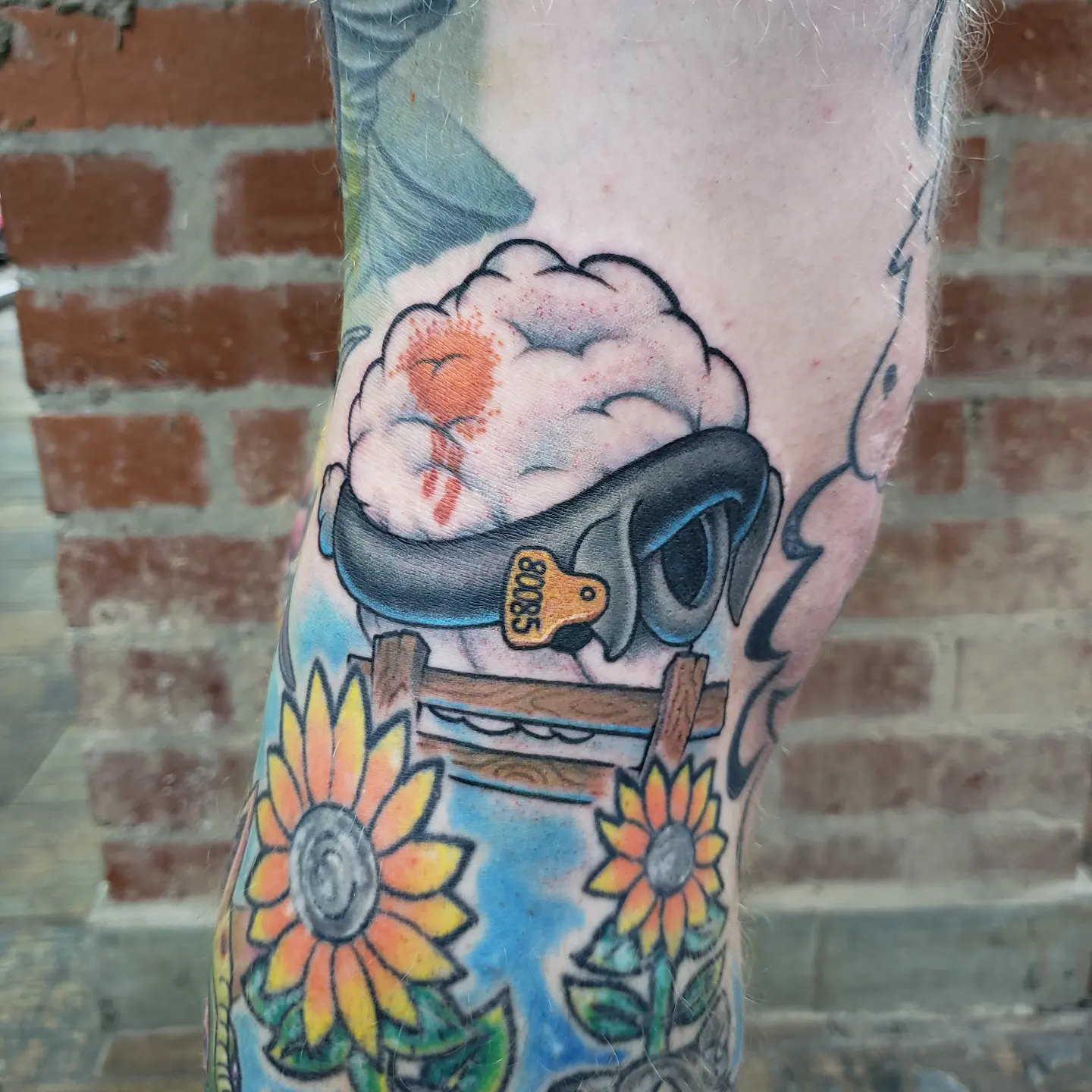 Brain with safety harness American traditional tattoo on the forearm by Don Taylor