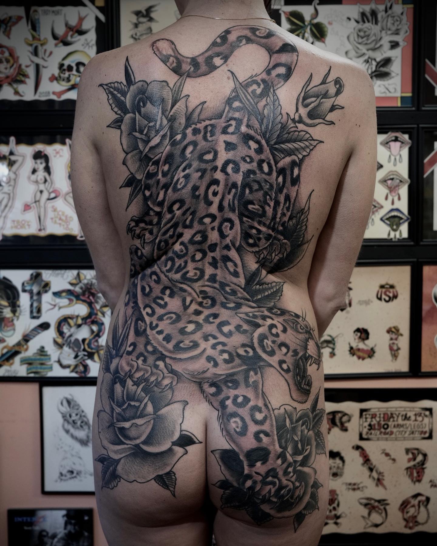 Leopard and roses American traditional tattoo on the back by Troy Mort, Altoona, Pennsylvania