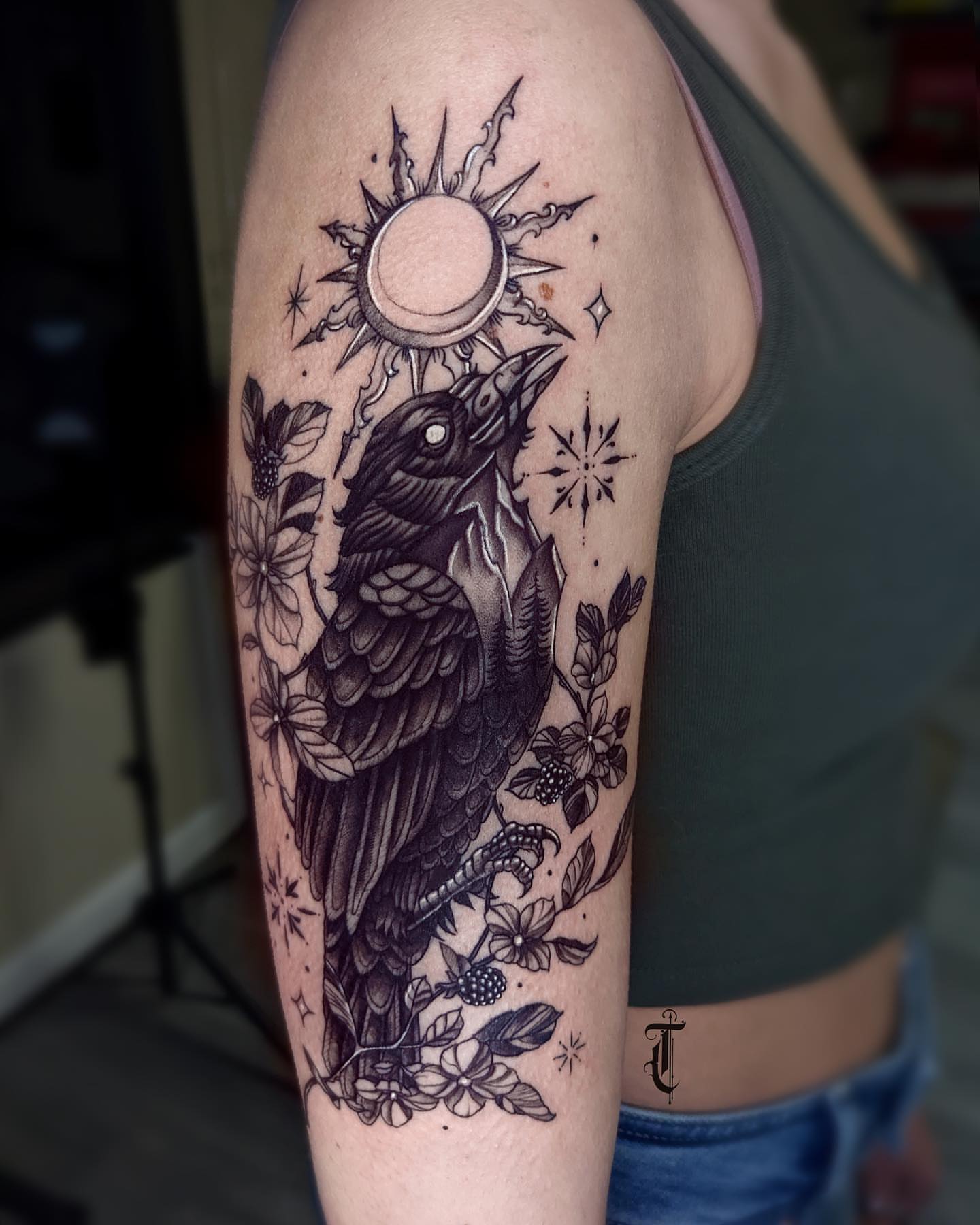 Crow and floral realism tattoo on the forearm by Tattoos in Federal Way, WA🖤