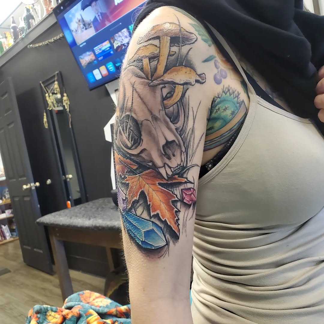 Animal skull with mushrooms and leaves American traditional tattoo on the forearm by @stevison15