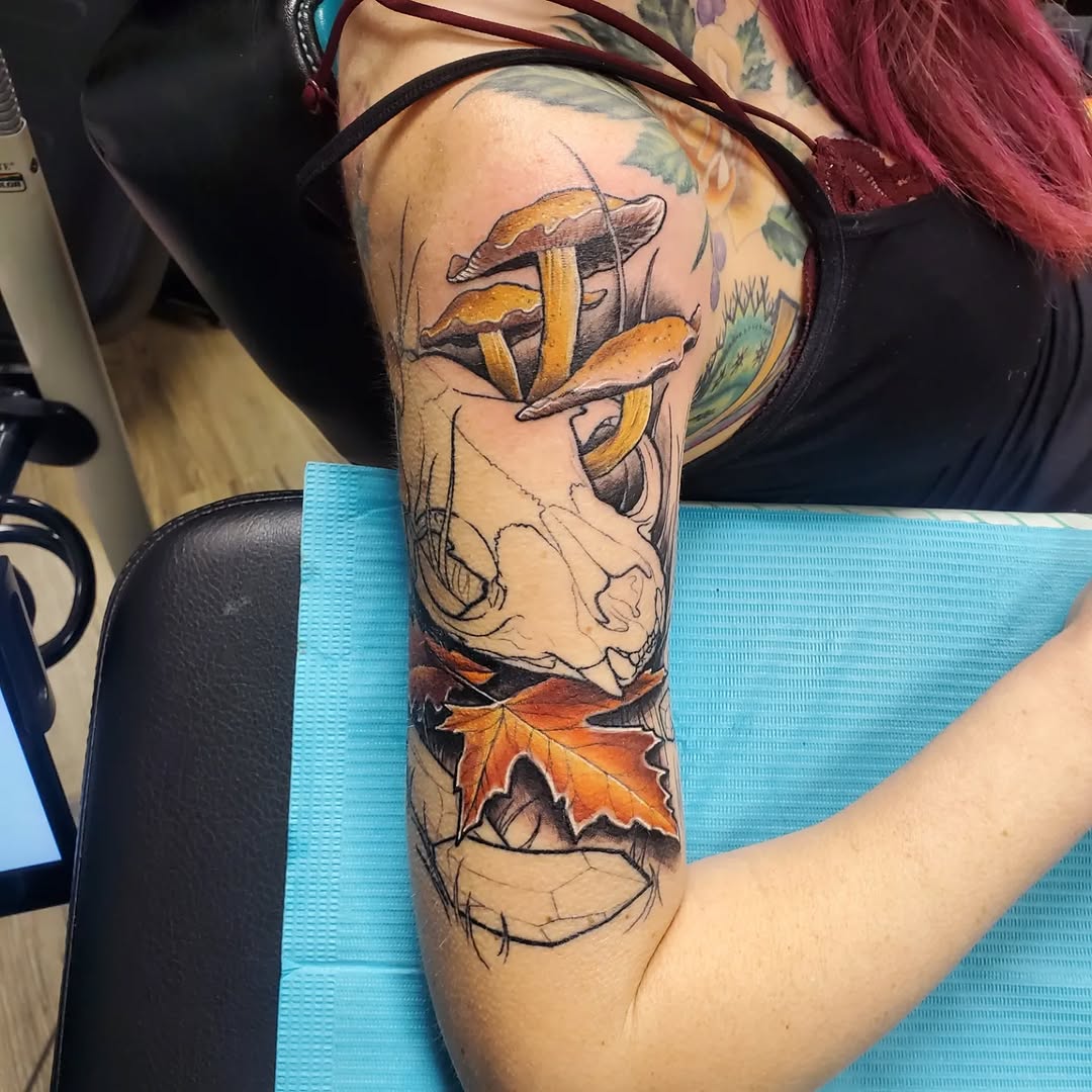 Skull with mushrooms and autumn leaves American traditional tattoo on the forearm by @stevison15