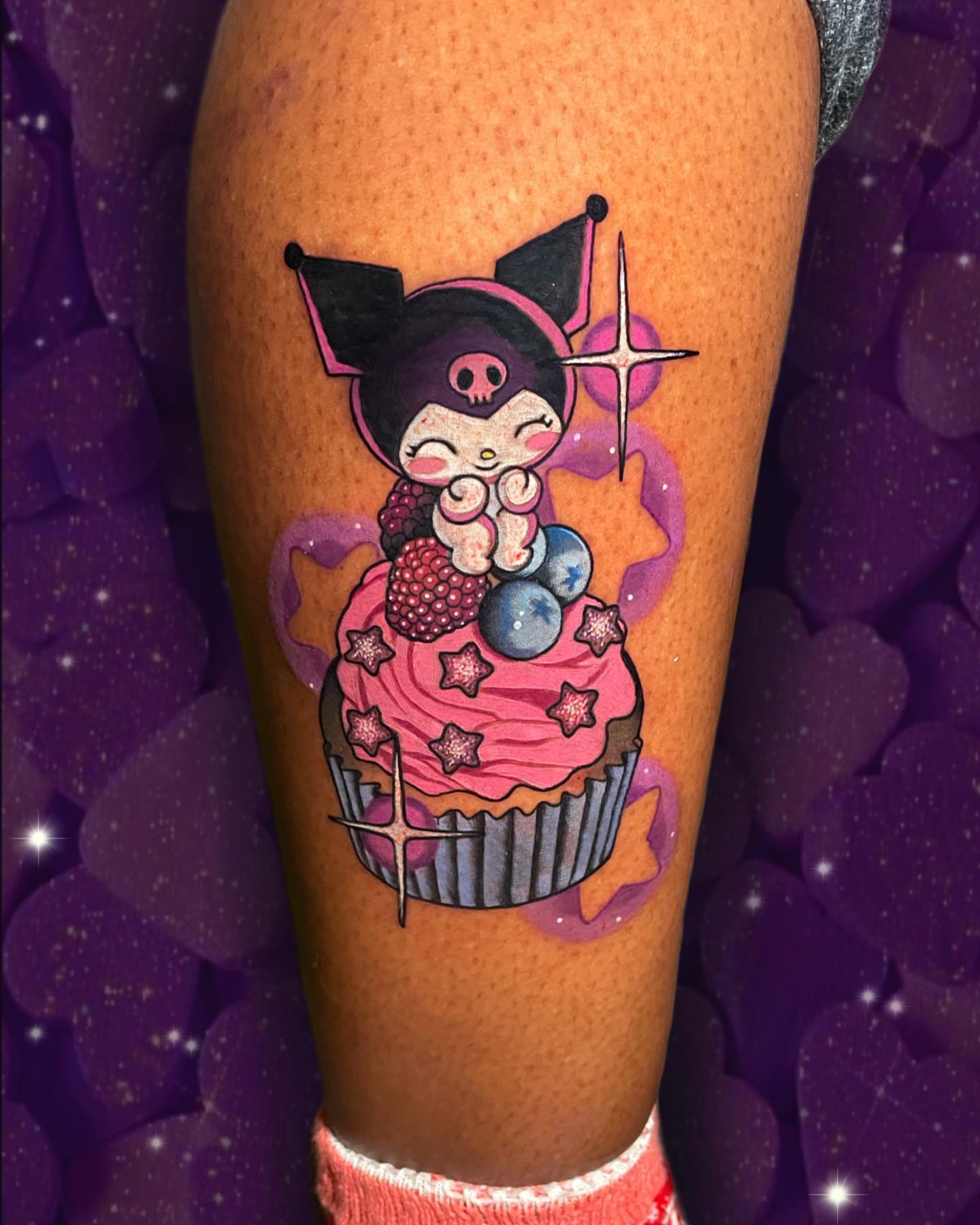 Cupcake character illustrative tattoo on the forearm by Wendy Ruiz