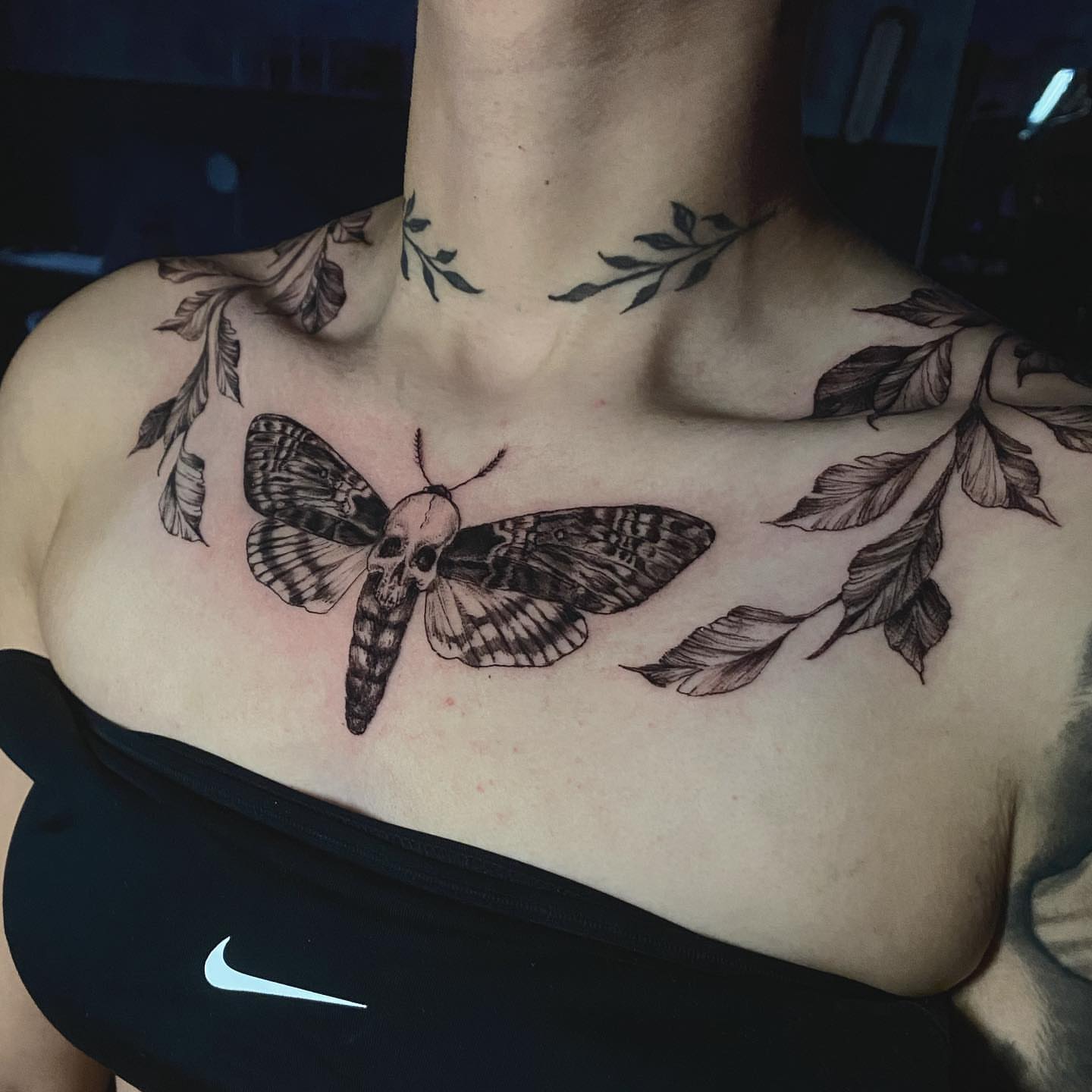 Moth with skull head realism tattoo on the chest by Sydney Dixon, Sacramento, California