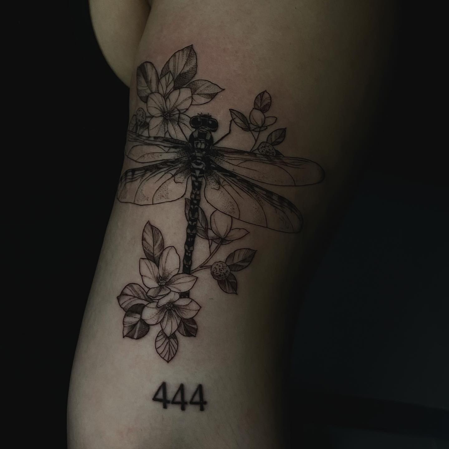 Dragonfly and flowers realism tattoo on the forearm by Sydney Dixon, Sacramento, California