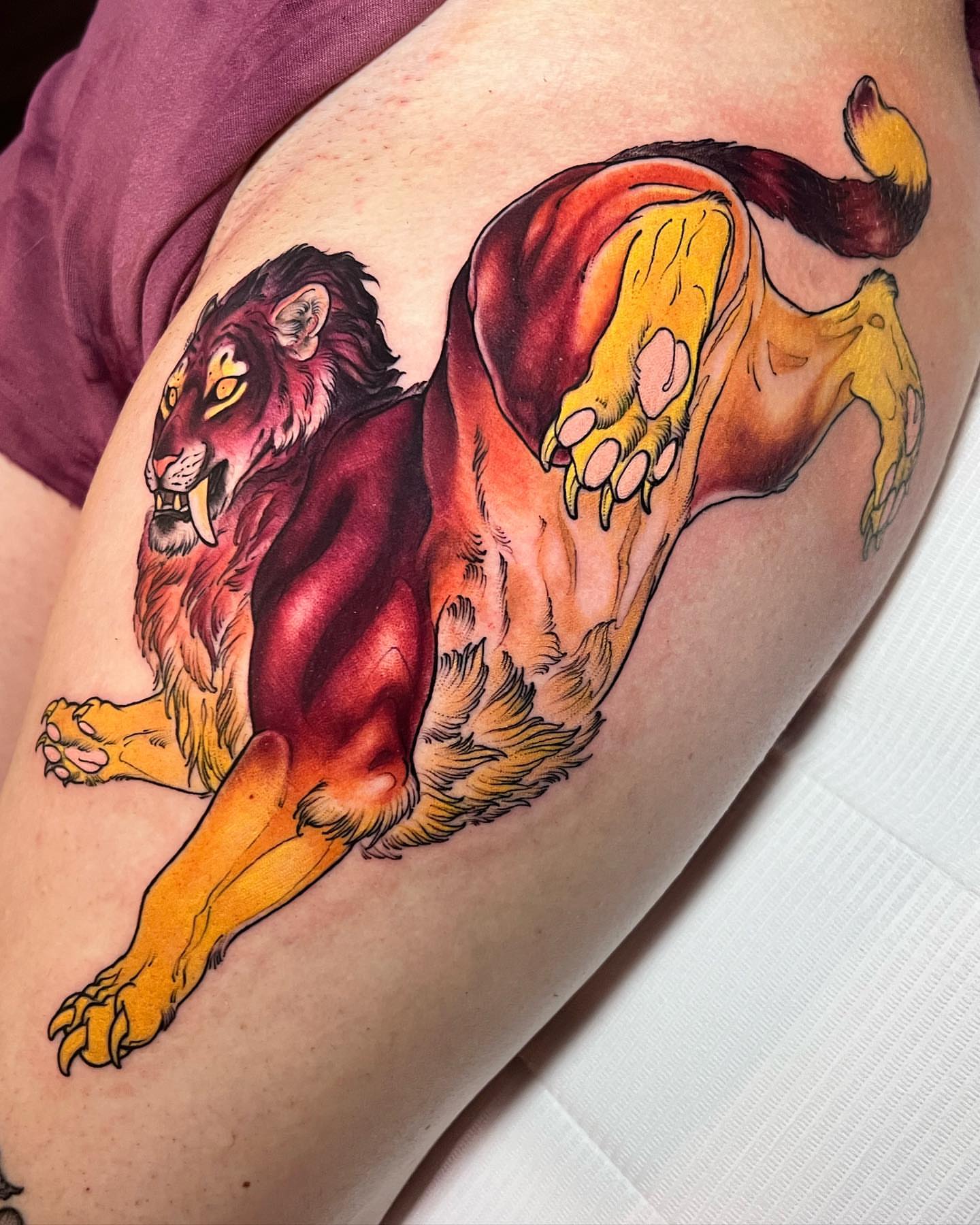 Lion realism tattoo on the thigh by Alisha Harding