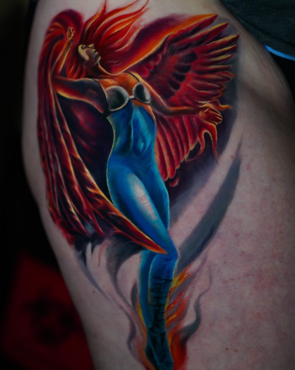 Dancer with wings illustrative tattoo on the shoulder by David Gordon