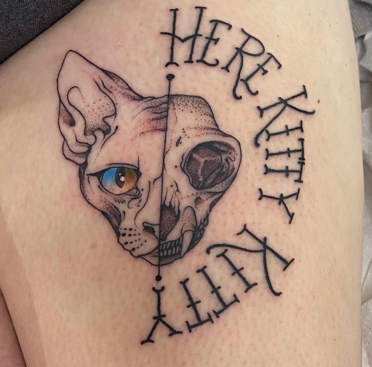 Cat skull dotwork tattoo on the thigh by Shamanic Ink