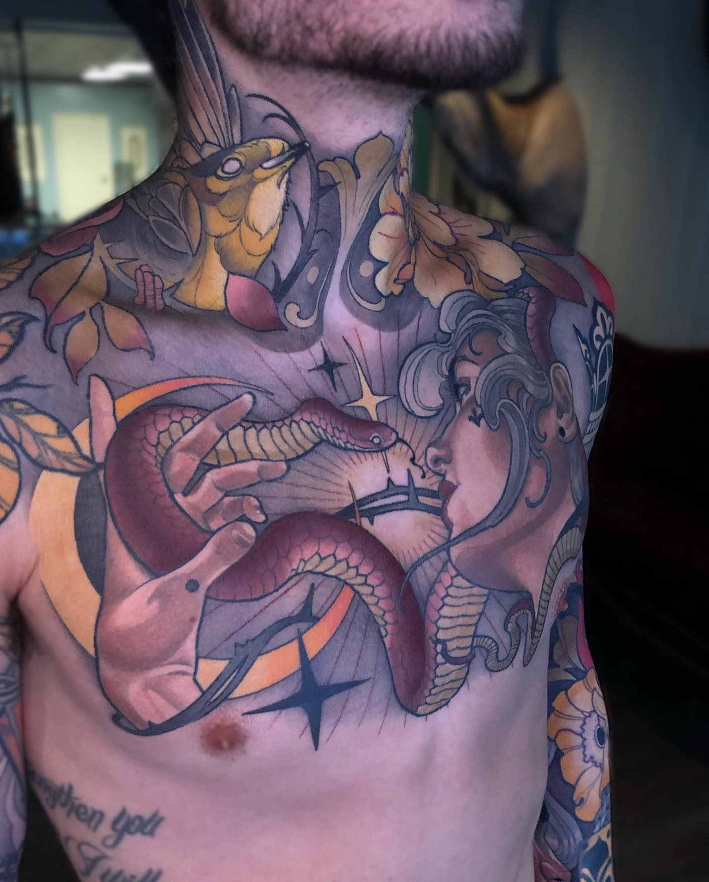Snake and woman American traditional tattoo on the chest by Levi Murphy