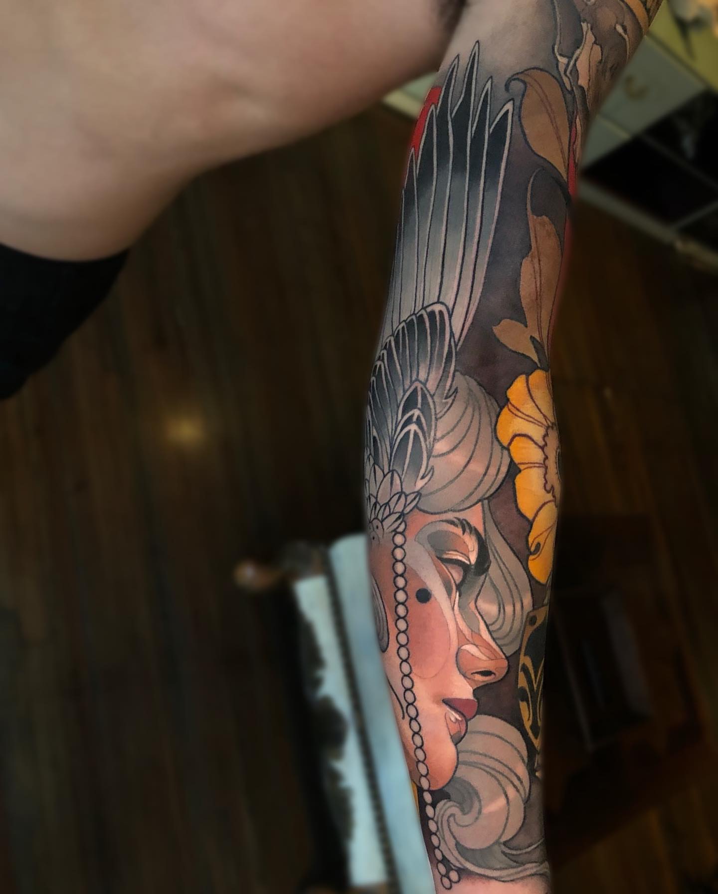 Woman's face American traditional tattoo on the forearm by Levi Murphy