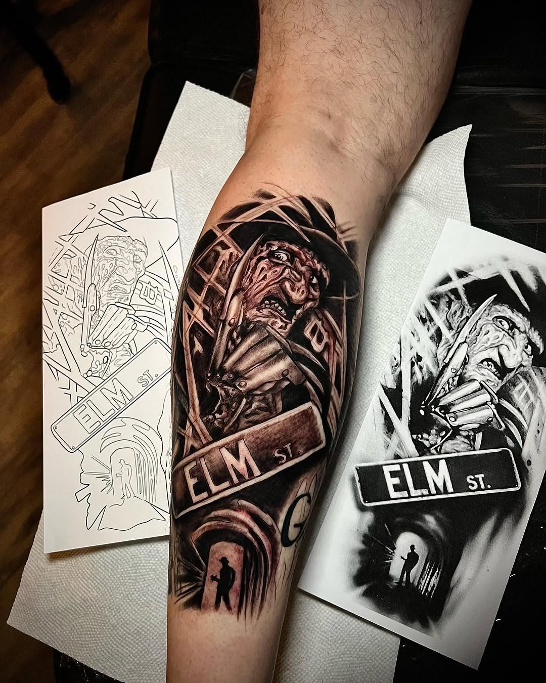 Freddy Krueger and Elm Street sign realism tattoo on the forearm by Lucky Valenzuela, Lakewood, Colorado