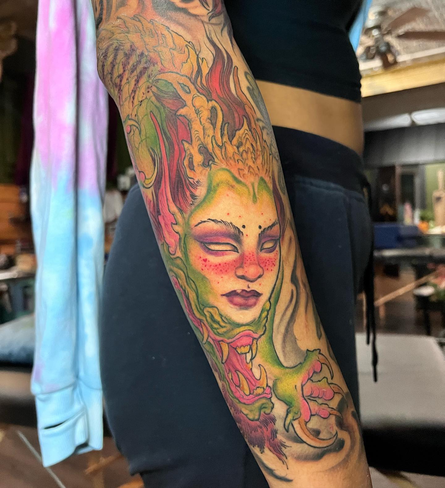 Flame-woman new school tattoo on the forearm by Alisha Harding