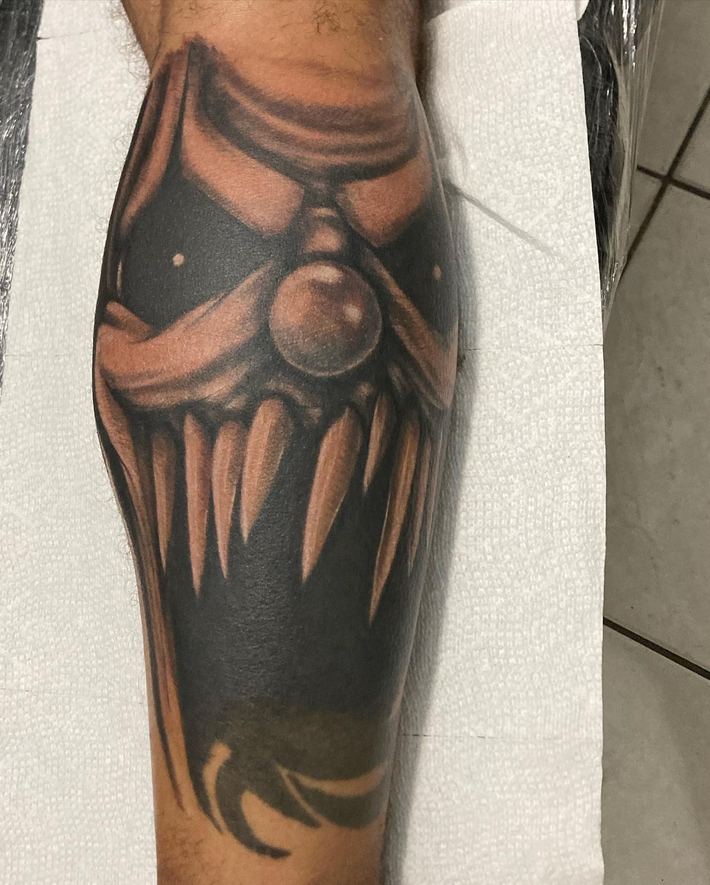 Mask dark realism tattoo on the forearm by payaso