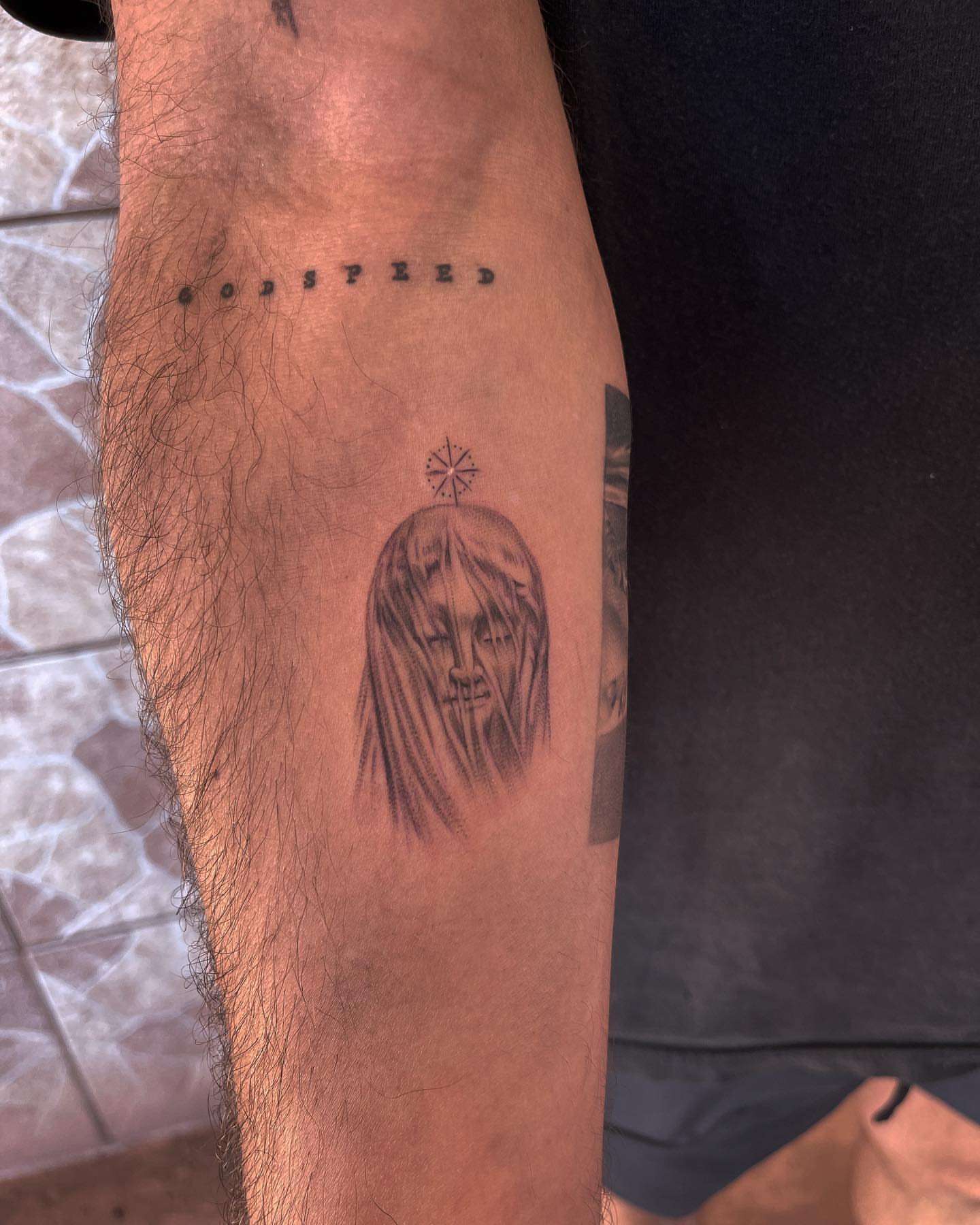Religious figure black and grey tattoo on the forearm by Carla V