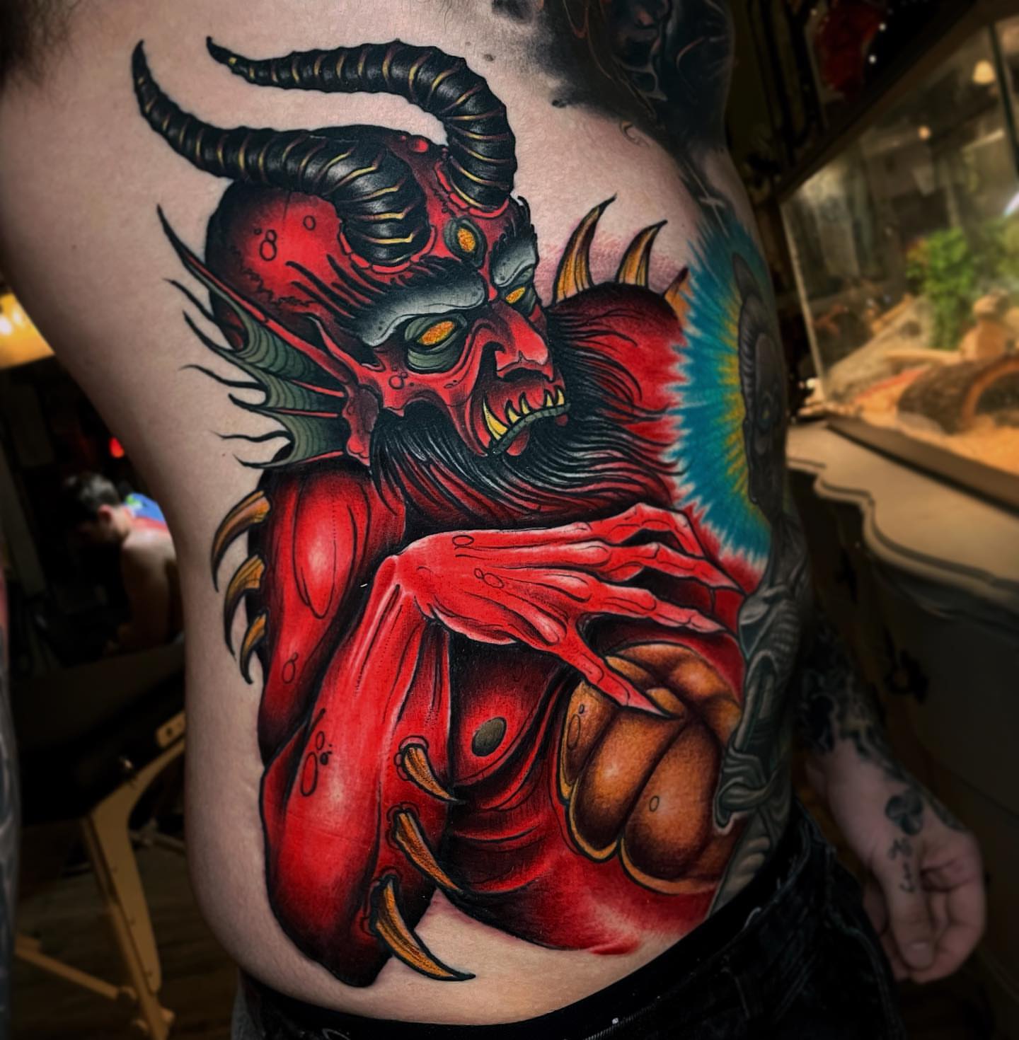 Demon dark realism tattoo on the torso by Ick Abrams