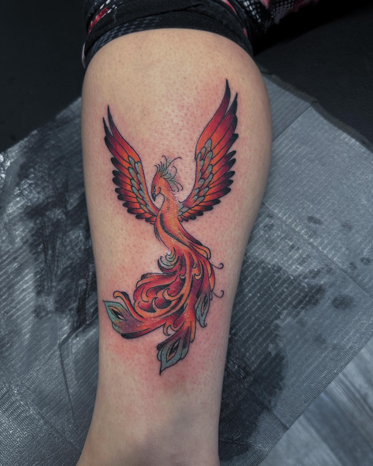 Phoenix new school tattoo on the thigh by duffs, San Marcos, California