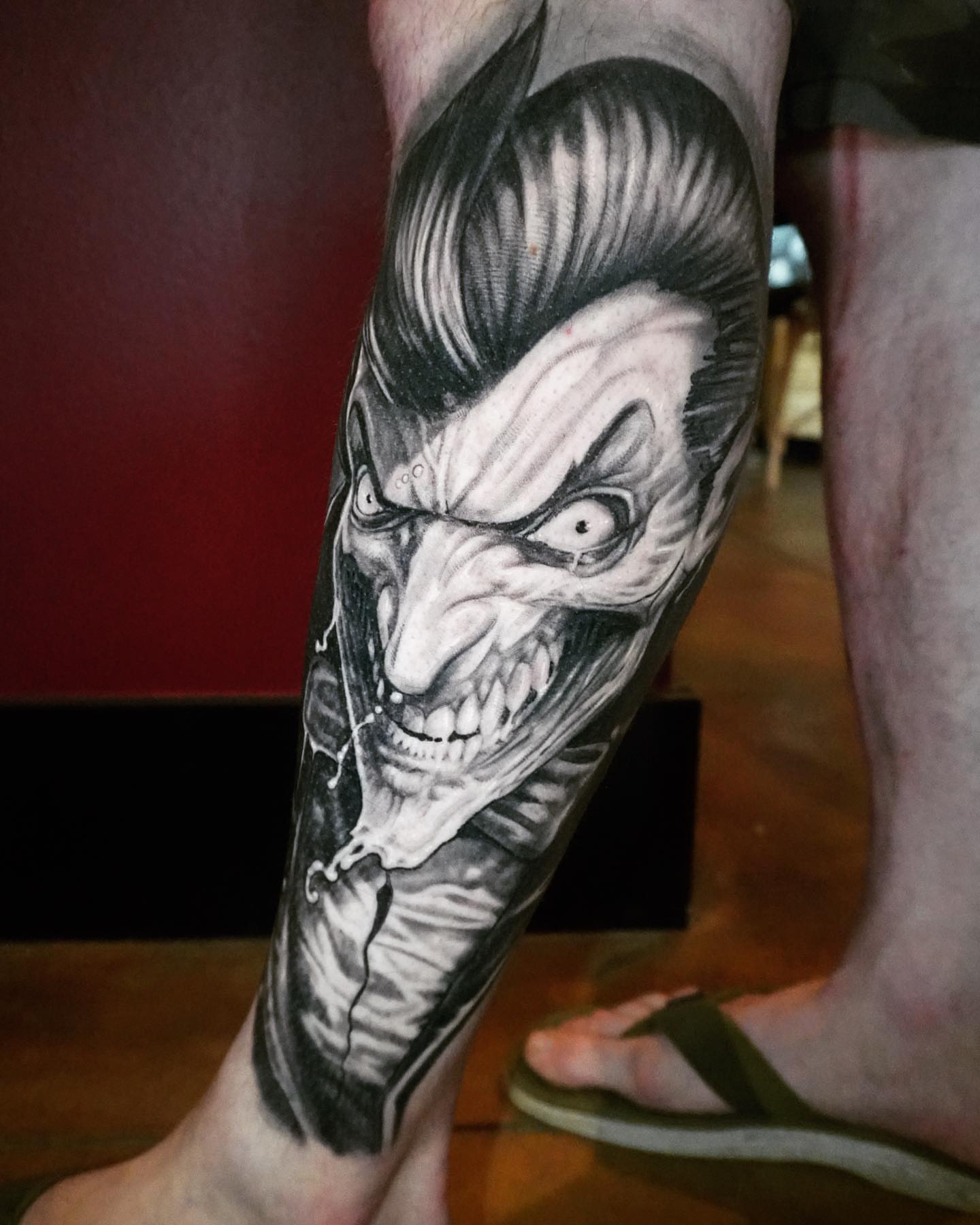 Joker realism tattoo on the calf by Jerm Rekow