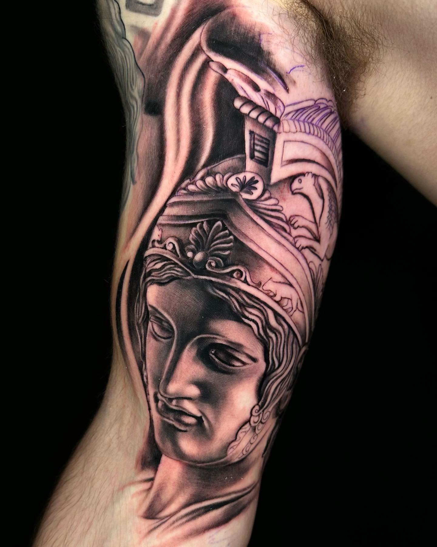 Statue head realism tattoo on the forearm by Alonzo Villa Tattoo