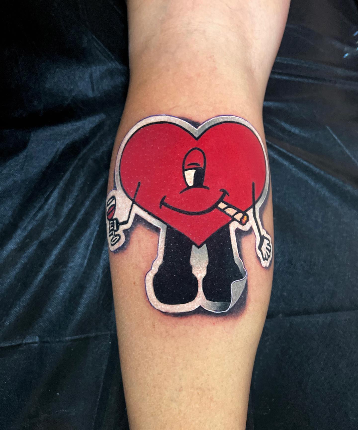Smiling heart American traditional tattoo on the forearm by Brian Horowitz