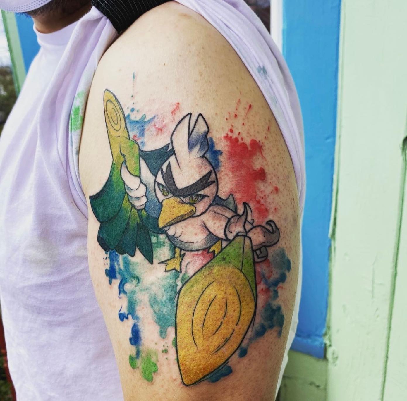Duckling watercolor tattoo on the shoulder by Shamanic Ink