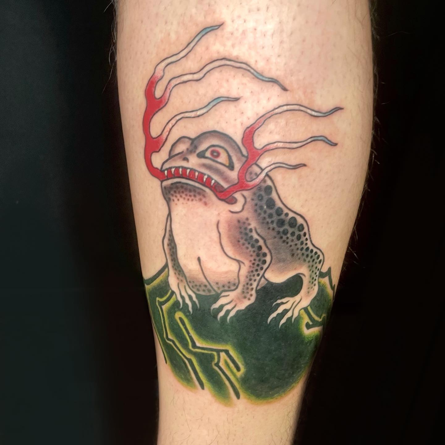 Frog American traditional tattoo on the forearm by Seth Griffin