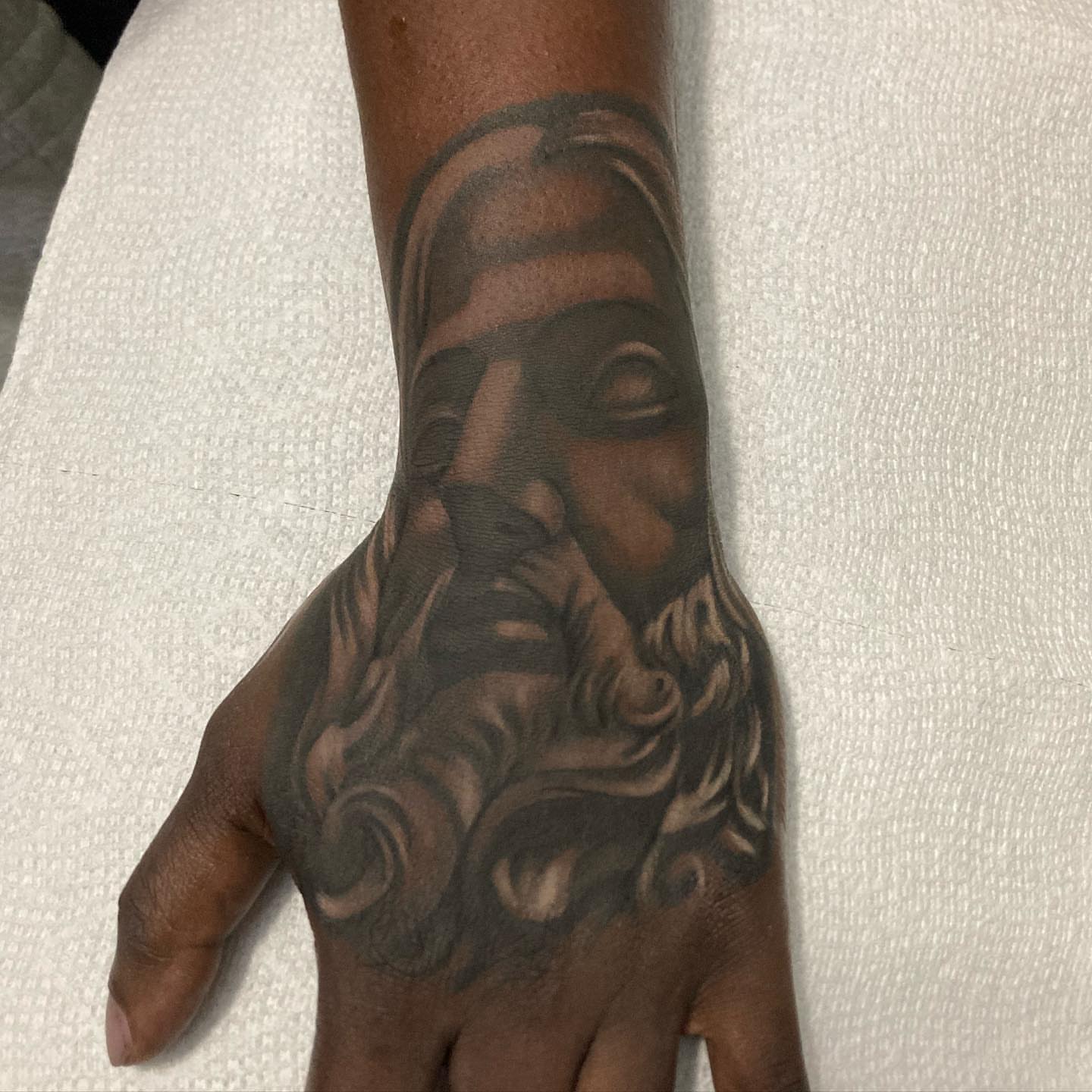 Bearded man black and grey tattoo on the hand by payaso