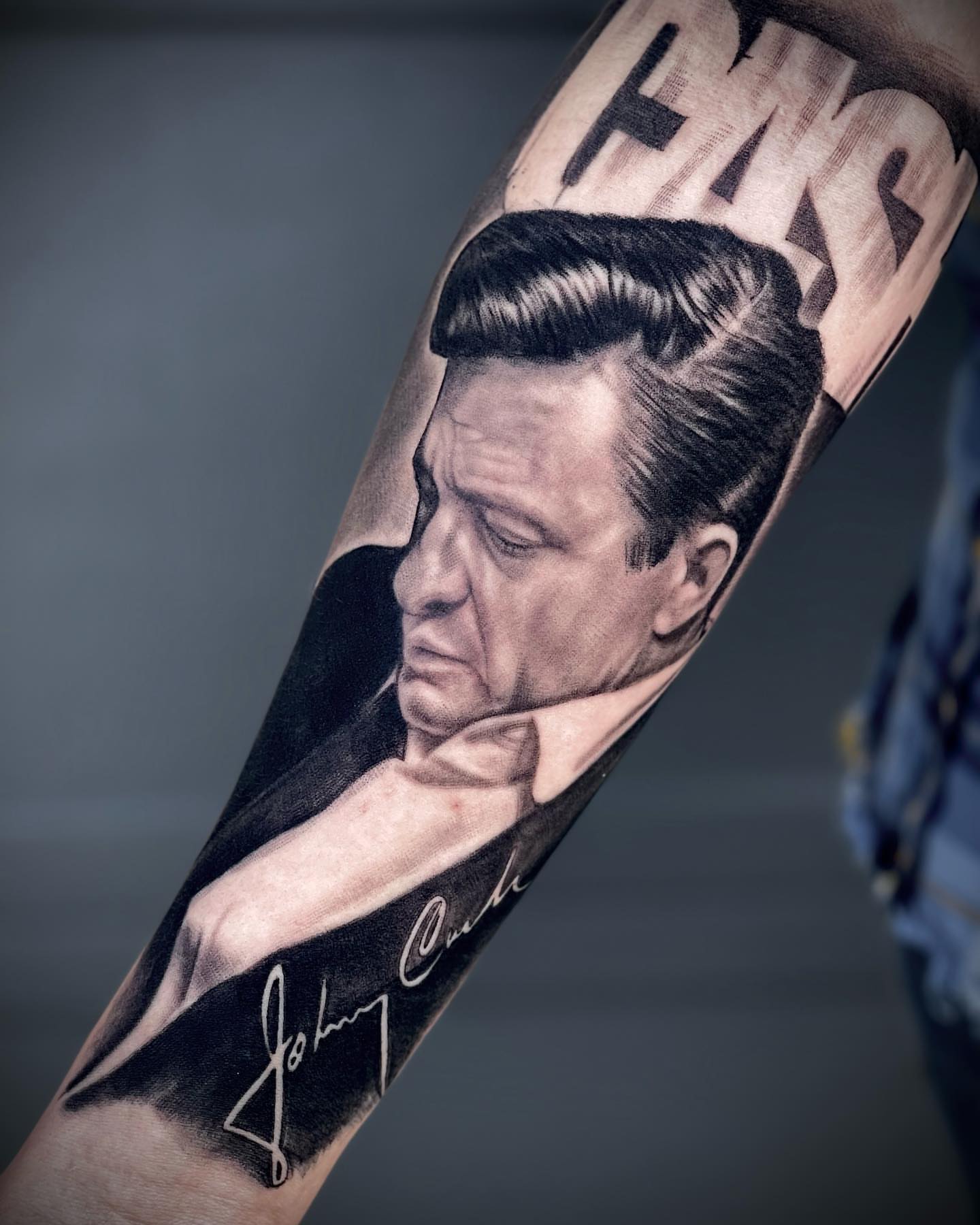Johnny cash realism tattoo on the forearm by Jerm Rekow