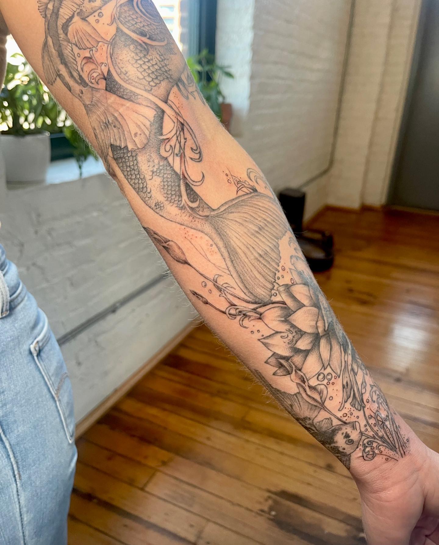 Mermaid and lotus realism tattoo on the forearm by 𓆏 Alyssa Carbonara 𓆏