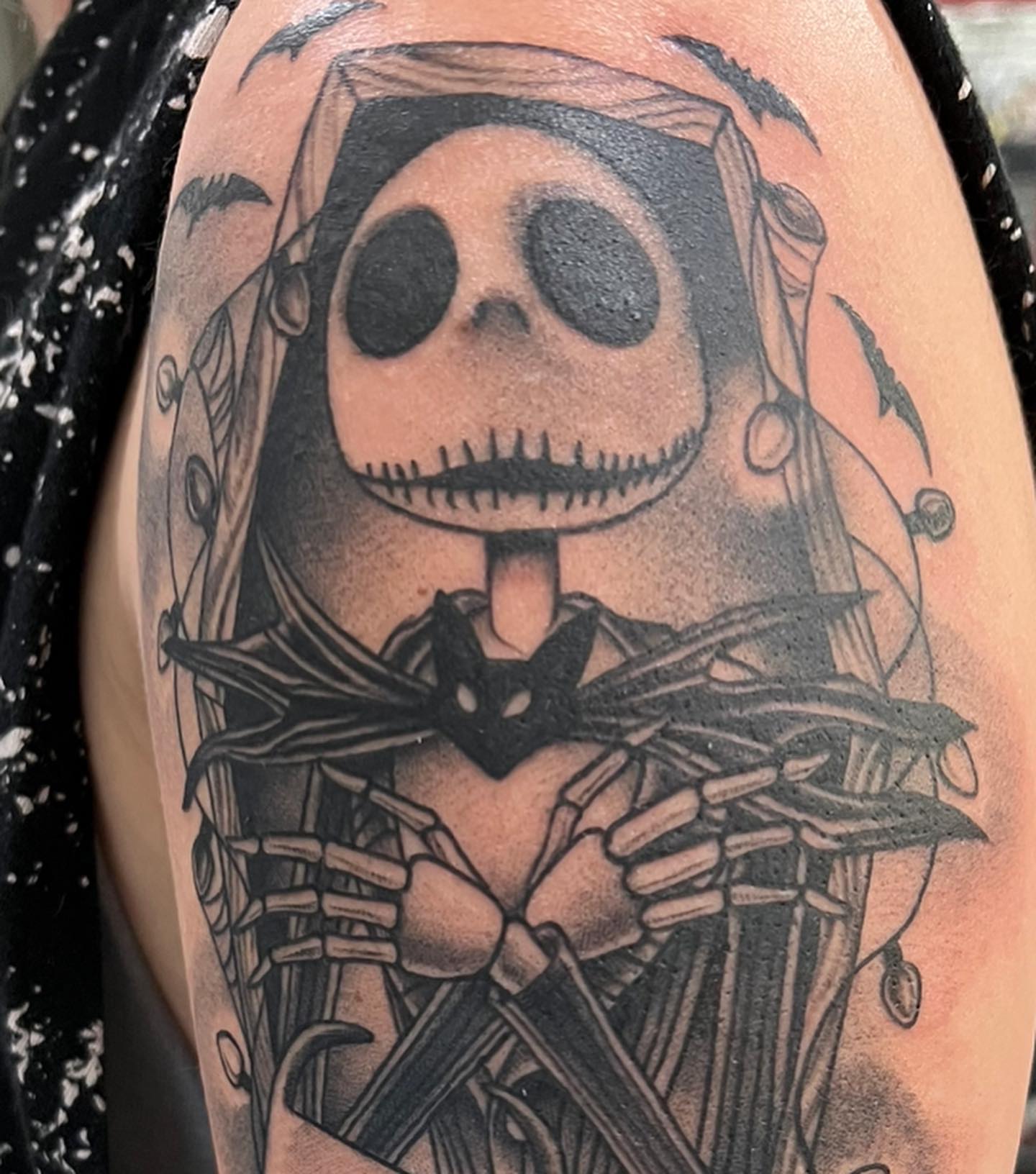 Jack Skellington dark realism tattoo on the upper arm by Walter Frank