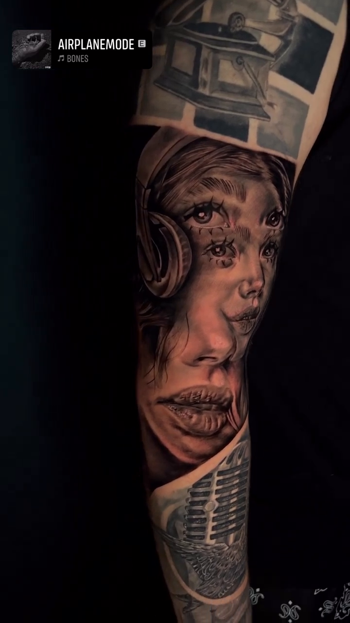 Surreal portrait with headphones and microphone realism tattoo by Luis Manuel Olivera, North Miami, Florida