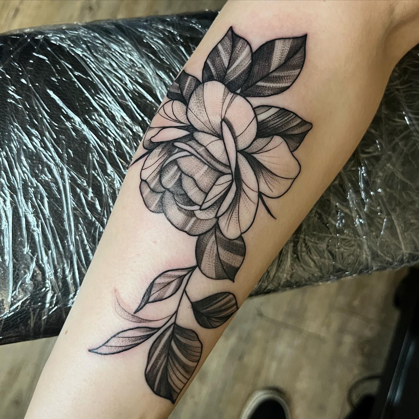 Rose dotwork tattoo on the forearm by Christopher McGlone