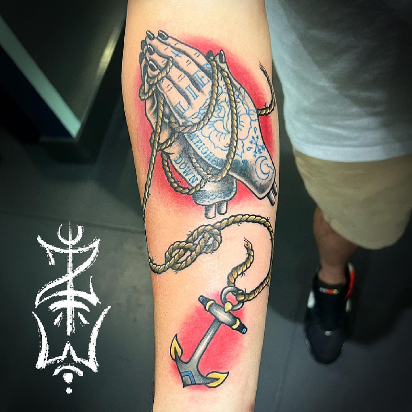 Praying hands with anchor American traditional tattoo on the forearm by Zack Havoc