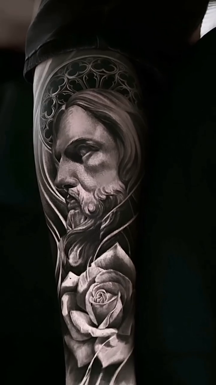 Jesus Christ and rose realism tattoo by Luis Bravo