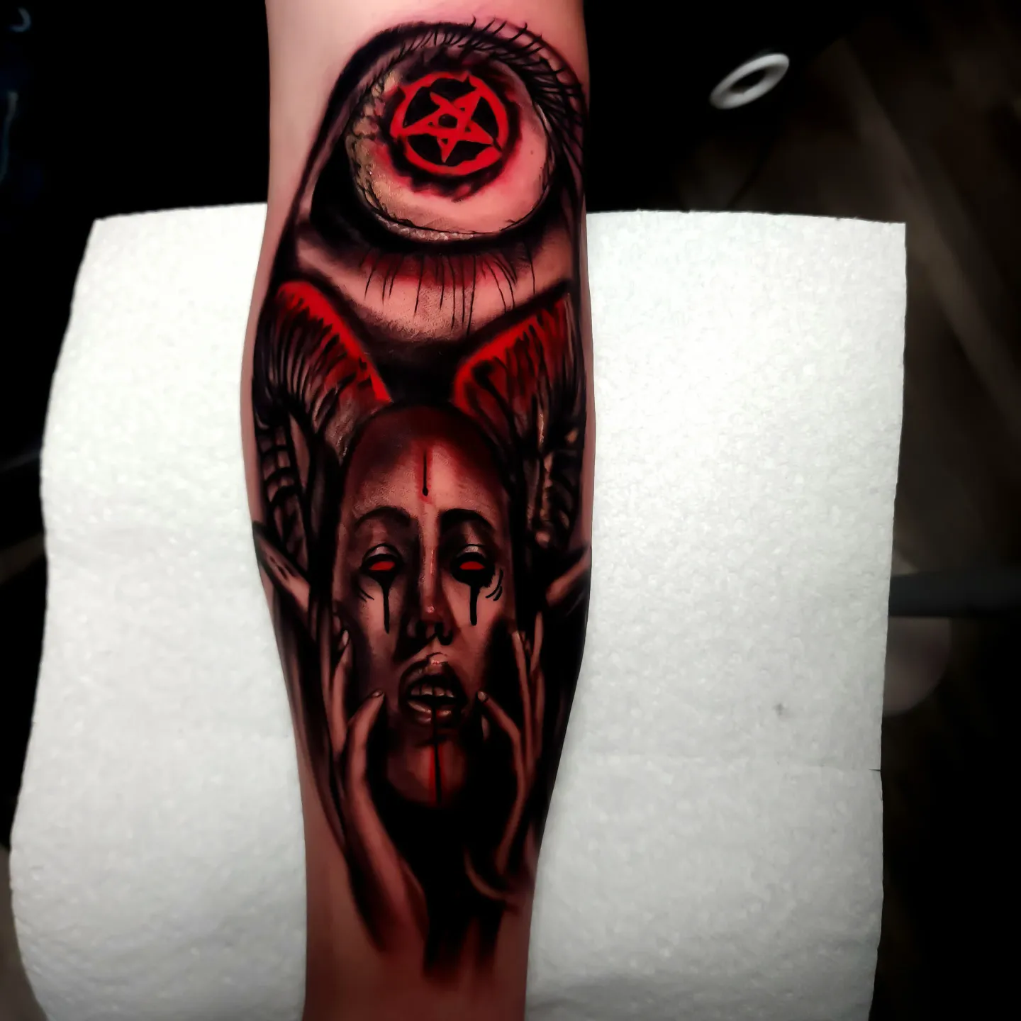 Demon face dark realism tattoo on the forearm by Color Realism Tattoos - Metro Detroit