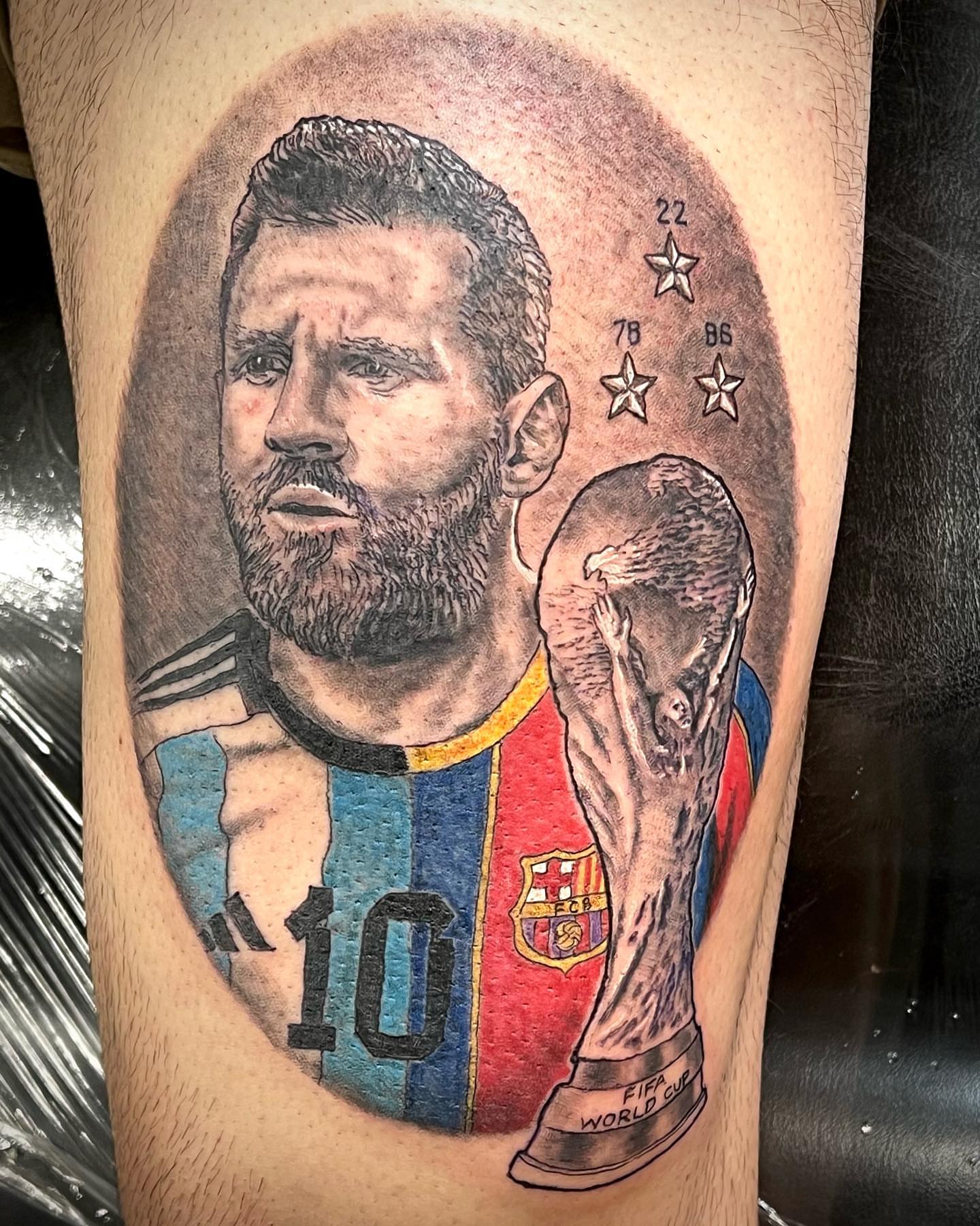Messi with FIFA World Cup trophy realism tattoo on the thigh by Iconic Ink, Millbury, Massachusetts
